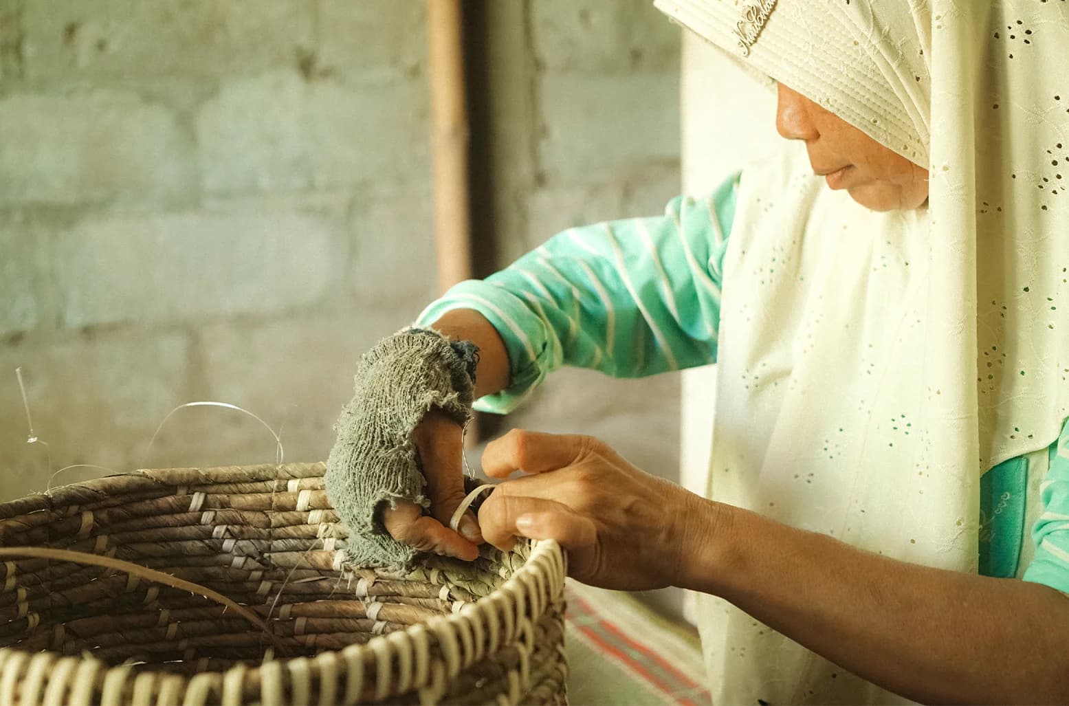 Woman weaving basket
